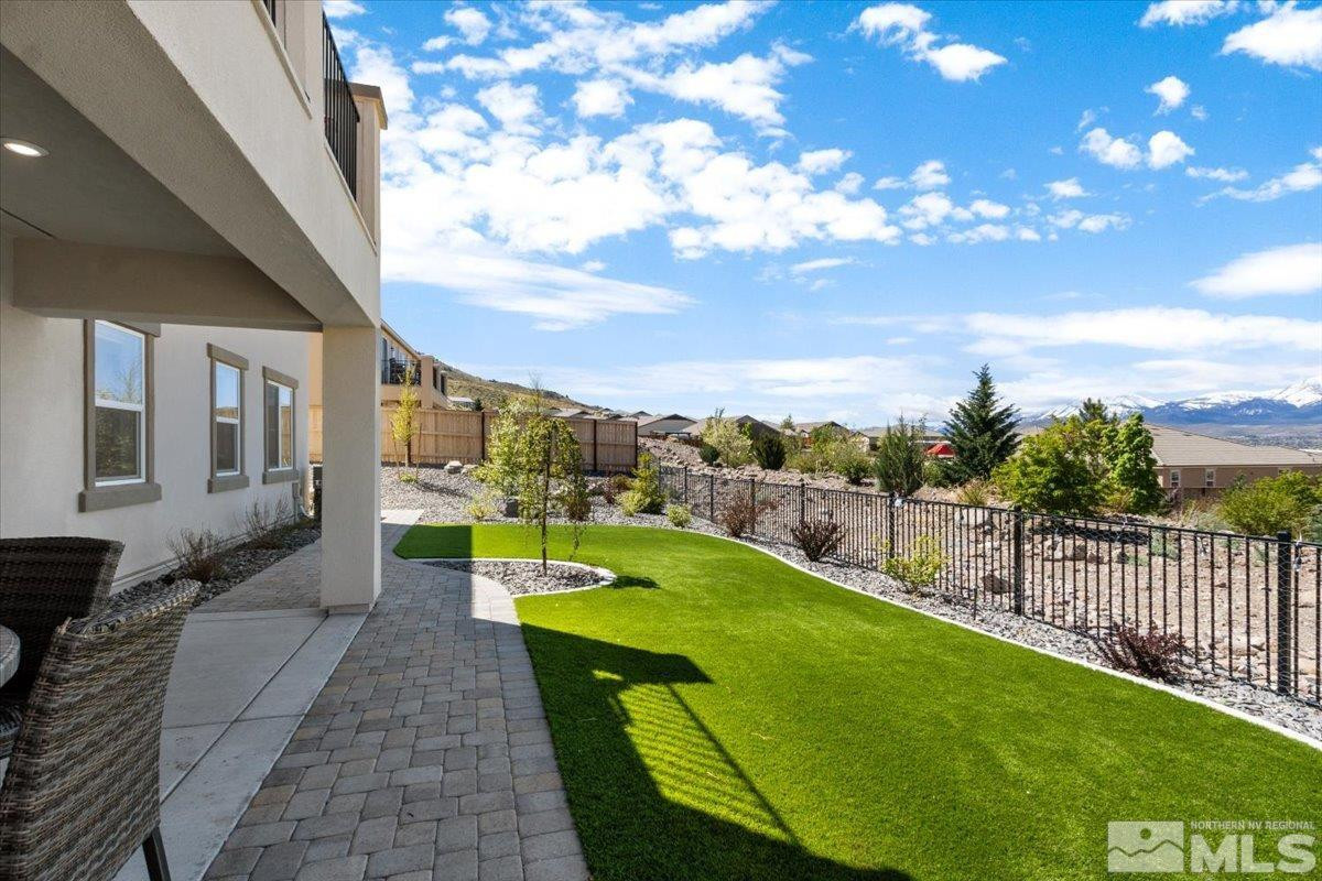 10385 Alchemy Court Reno, NV 89521 - Photo 34 of 40 a view of a swimming pool with a garden