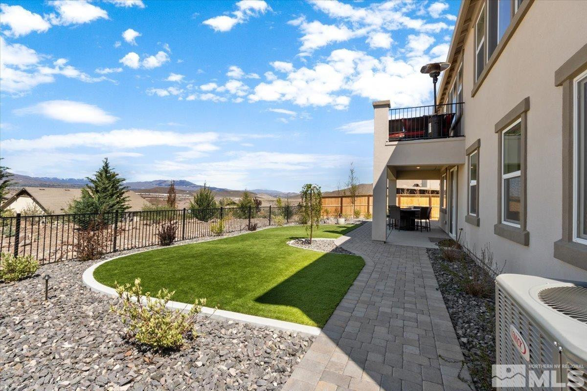 10385 Alchemy Court Reno, NV 89521 - Photo 35 of 40 a view of a back yard of the house with a garden