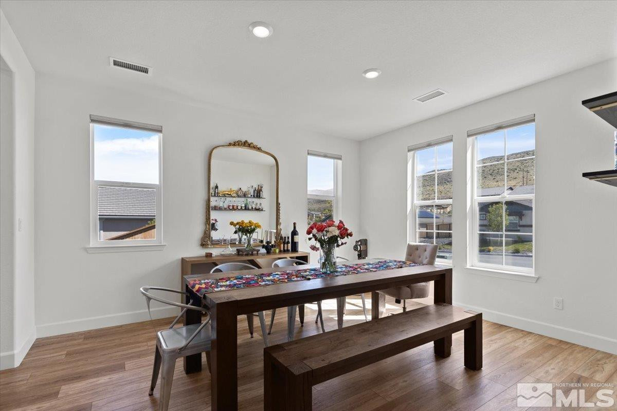 10385 Alchemy Court Reno, NV 89521 - Photo 5 of 40 a view of a dining room with furniture window and wooden floor