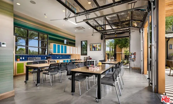 a view of a dining room with furniture window and outdoor kitchen