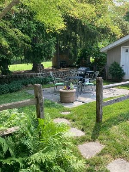 679 Mountain Boulevard, Unit 6 Watchung, NJ 07069 - Photo 13 of 13 a backyard of a house with yard and outdoor seating
