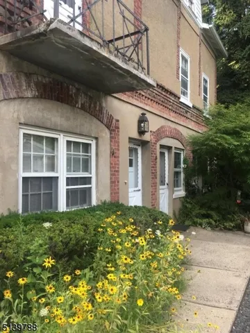 a view of a house with a garden