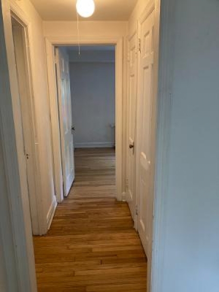 679 Mountain Boulevard, Unit 6 Watchung, NJ 07069 - Photo 9 of 13 a view of a hallway with wooden floor and staircase