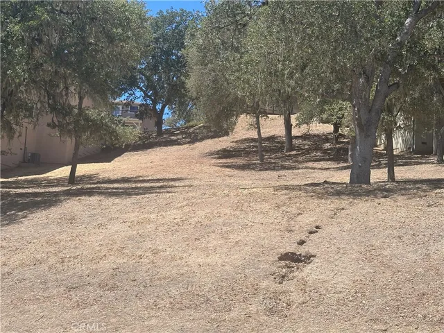 a view of a water fountain and a floor to ceiling window