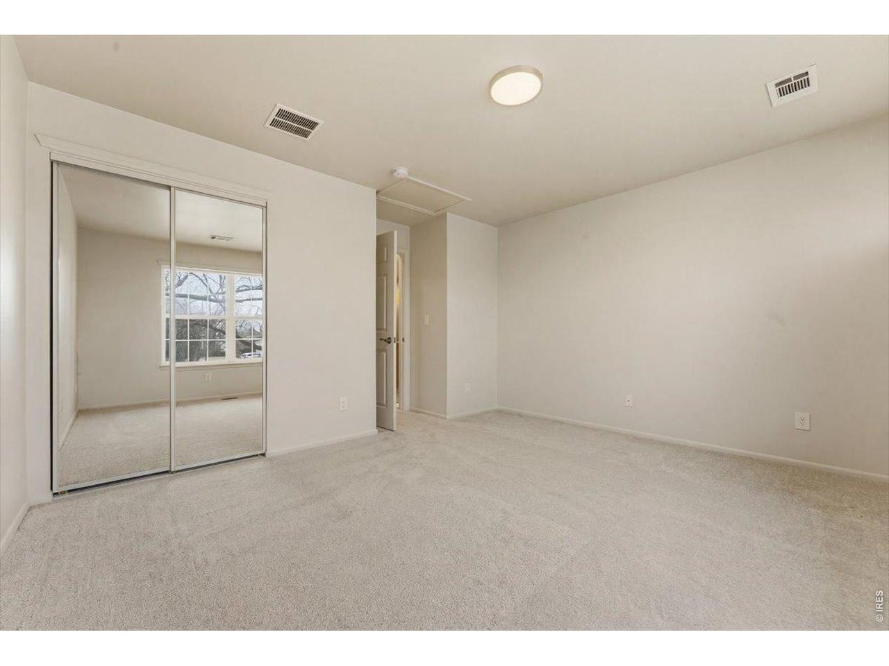 2551 West 24th Street, Unit A6 Greeley, CO 80634 - Photo 13 of 28 a view of an empty room with window
