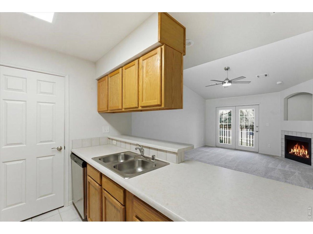 2551 West 24th Street, Unit A6 Greeley, CO 80634 - Photo 10 of 28 a kitchen with a sink cabinets and a window