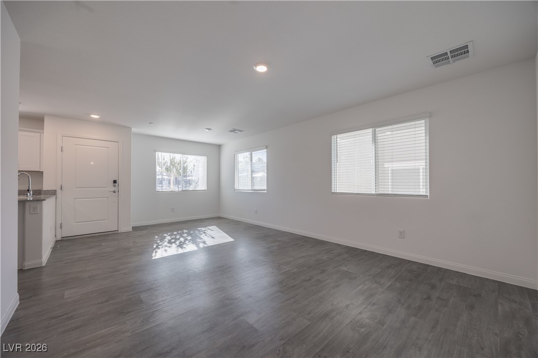 Entryway featuring dark wood finished floors and recessed lighting