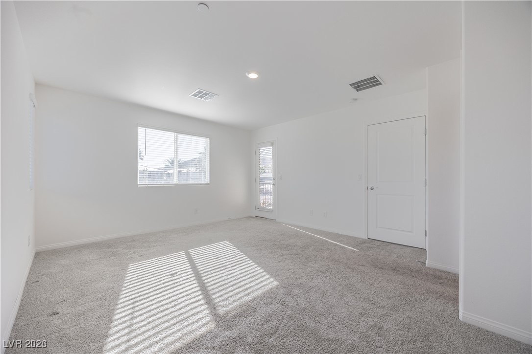 12185 Scarlet Ember Road, Unit 4 Las Vegas, NV 89183 - Photo 13 of 40 Unfurnished room with carpet floors and recessed lighting