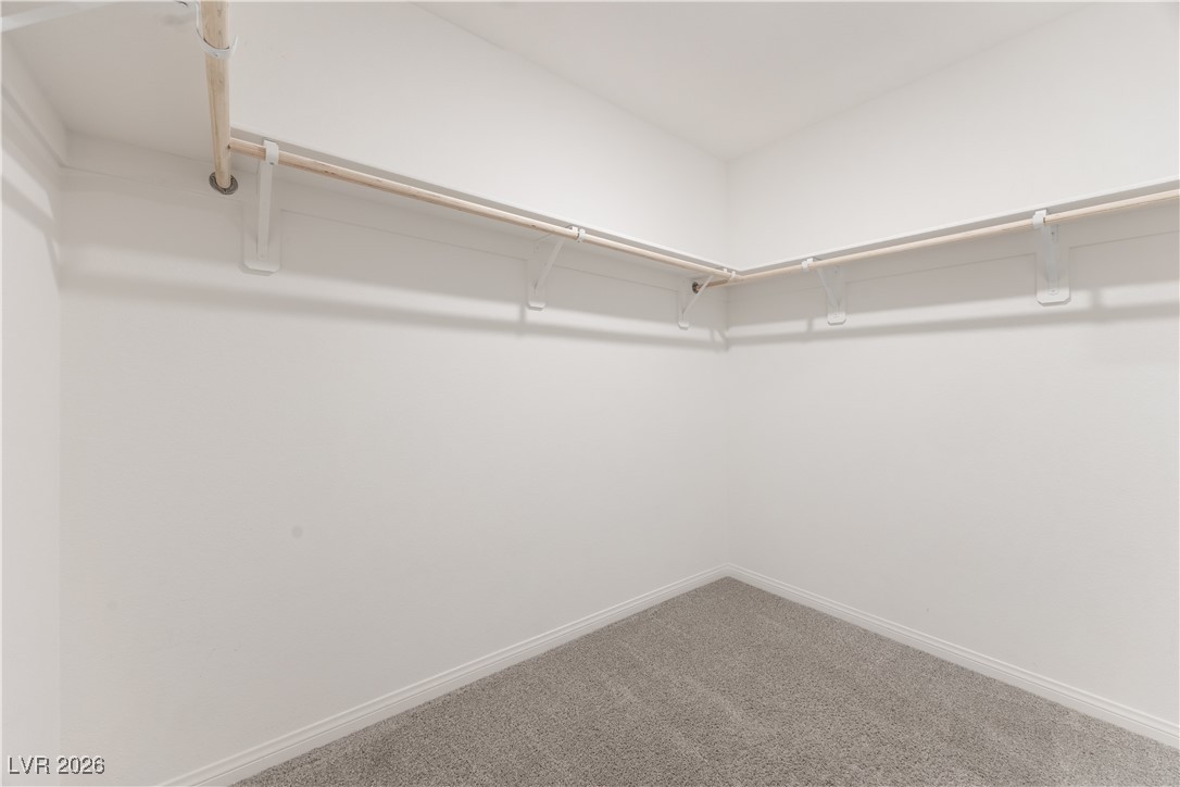 12185 Scarlet Ember Road, Unit 4 Las Vegas, NV 89183 - Photo 15 of 40 Spacious closet with carpet floors