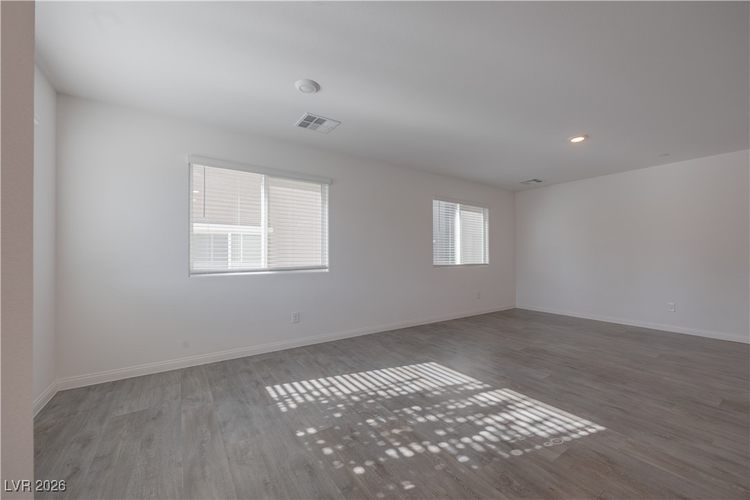 12185 Scarlet Ember Road, Unit 4 Las Vegas, NV 89183 - Photo 2 of 40 Unfurnished room with recessed lighting and wood finished floors