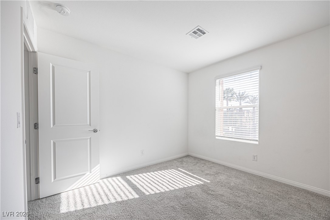 12185 Scarlet Ember Road, Unit 4 Las Vegas, NV 89183 - Photo 21 of 40 Spare room with carpet and baseboards