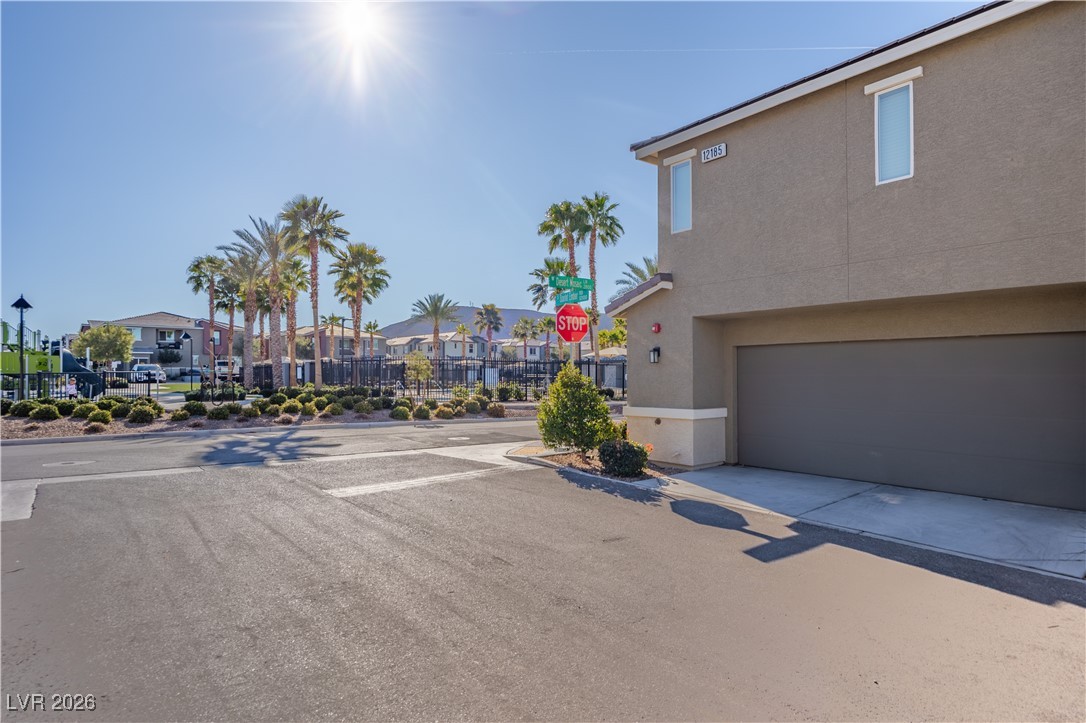 12185 Scarlet Ember Road, Unit 4 Las Vegas, NV 89183 - Photo 28 of 40 View of asphalt street with traffic signs and a residential view