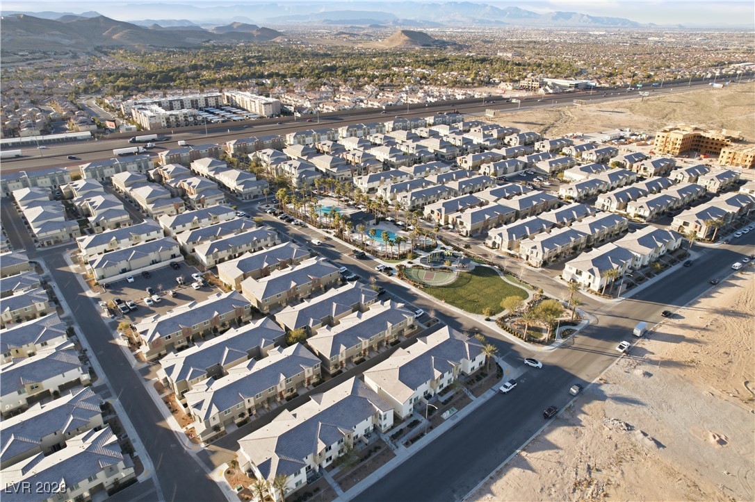 12185 Scarlet Ember Road, Unit 4 Las Vegas, NV 89183 - Photo 34 of 40 Aerial view of property and surrounding area featuring nearby suburban area