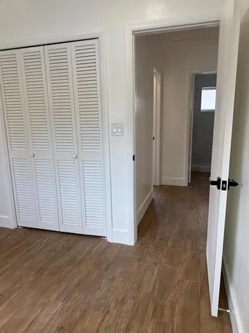 an empty room with wooden floor