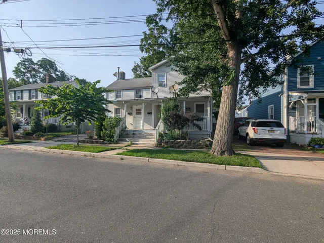 a view of street with parked cars
