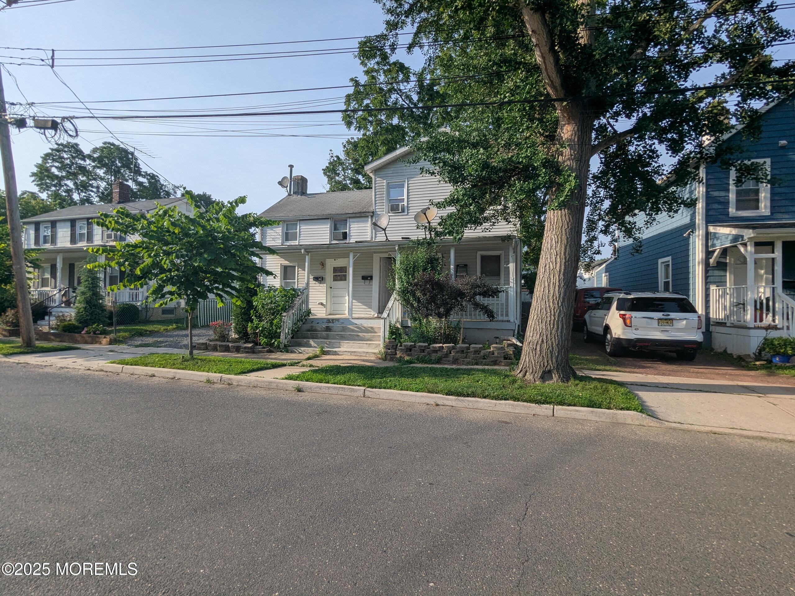 a view of street with parked cars