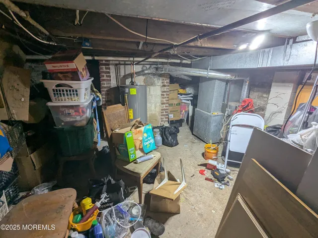 a view of a dining room with furniture and a chandelier