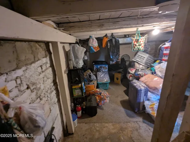 a view of a backyard with table and chairs and a large tree