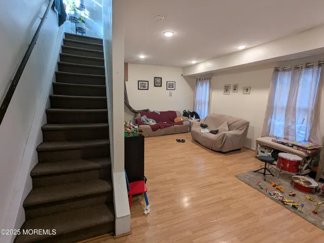 a view of a room with workspace and a window