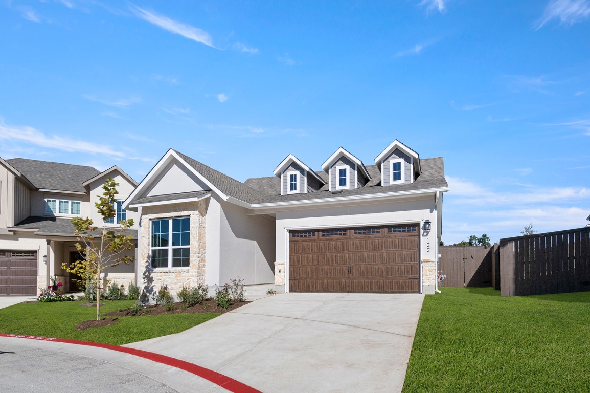 600 C-Bar Ranch Trail, Unit 122 Cedar Park, TX 78613 - Photo 15 of 31 a view of a house with a yard and garage