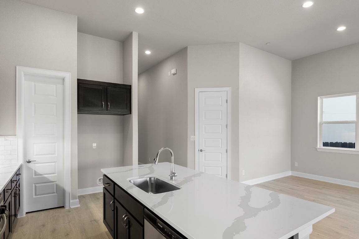 600 C-Bar Ranch Trail, Unit 122 Cedar Park, TX 78613 - Photo 19 of 31 a kitchen with a sink a stove and cabinets