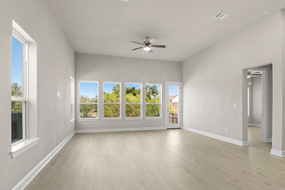 600 C-Bar Ranch Trail, Unit 122 Cedar Park, TX 78613 - Photo 22 of 31 wooden floor in an empty room with a window