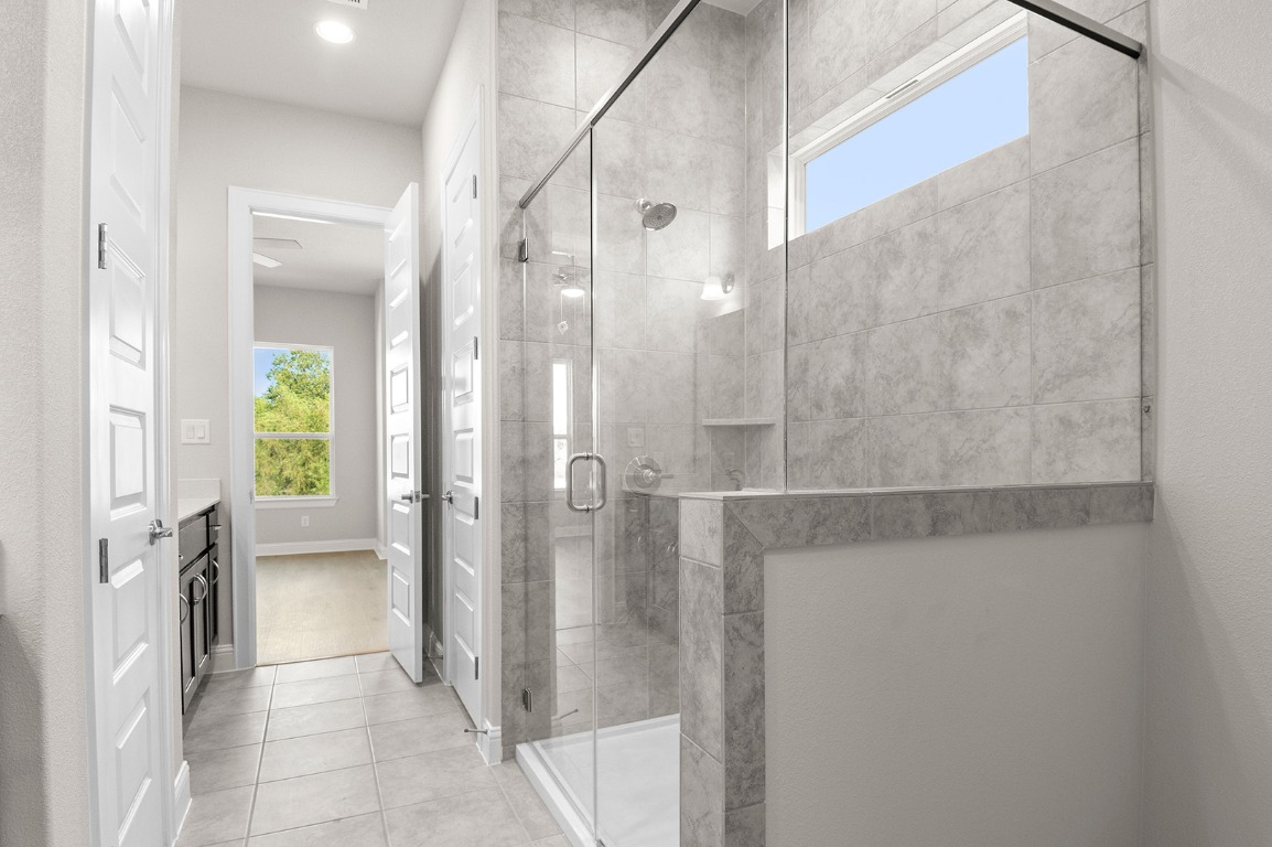 600 C-Bar Ranch Trail, Unit 122 Cedar Park, TX 78613 - Photo 27 of 31 a view of a bathroom with a glass shower door