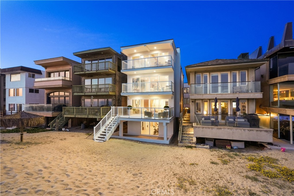 a view of a house with a yard and furniture