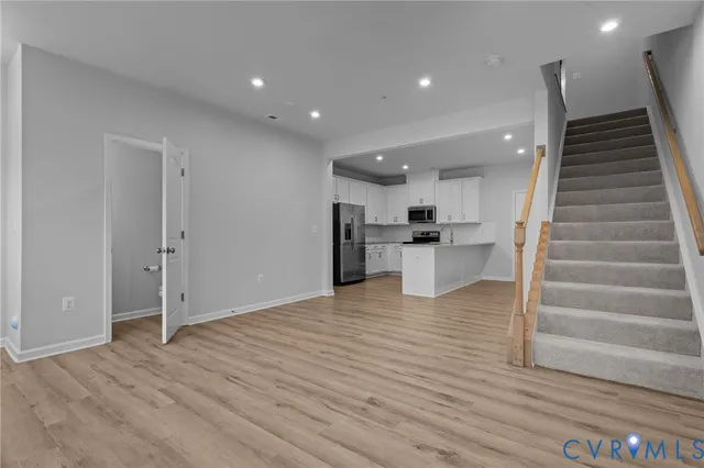 a view of kitchen with furniture and wooden floor