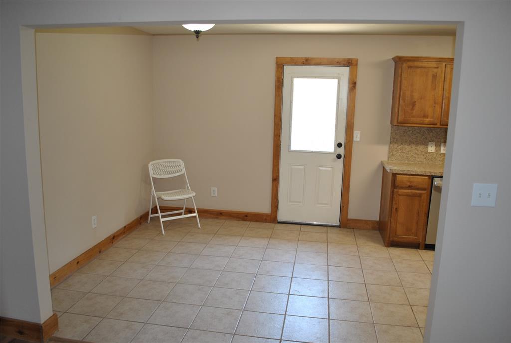 515 East Liberty Street Pilot Point, TX 76258 - Photo 14 of 25 a view of an empty room with closet and a window