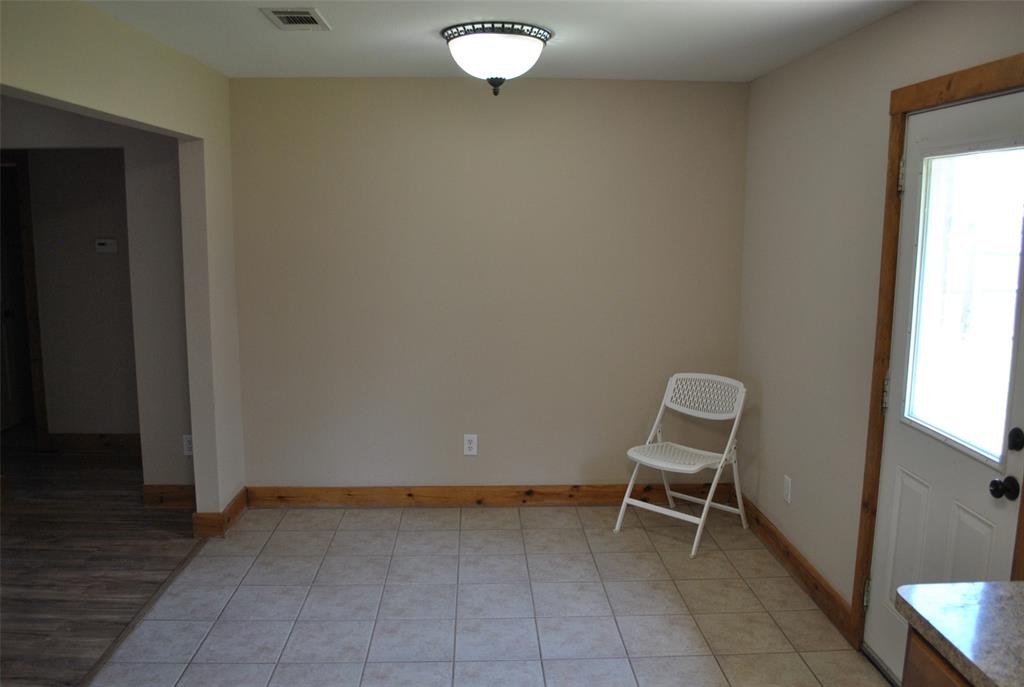 515 East Liberty Street Pilot Point, TX 76258 - Photo 17 of 25 a view of chair and table in a room