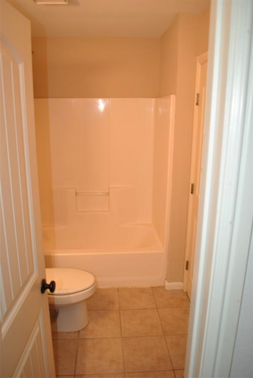 515 East Liberty Street Pilot Point, TX 76258 - Photo 24 of 25 a bathroom with a shower