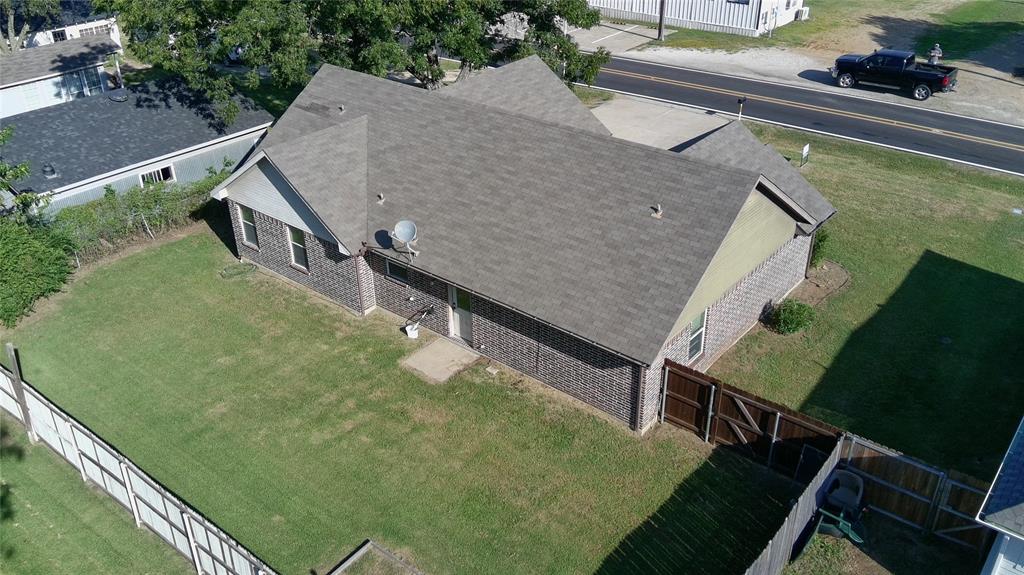 515 East Liberty Street Pilot Point, TX 76258 - Photo 4 of 25 a aerial view of a house with swimming pool