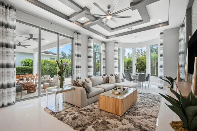 a bathroom with a granite countertop sink a toilet a mirror and shower