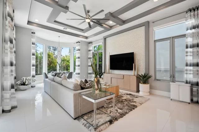 a bathroom with a sink a large mirror and a bathtub