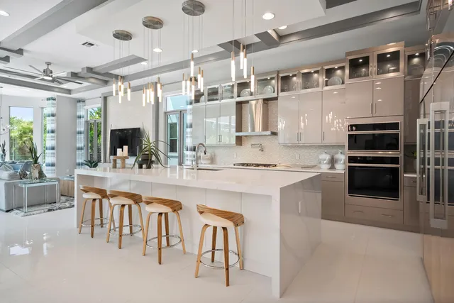 a living room with furniture a flat screen tv and a large window