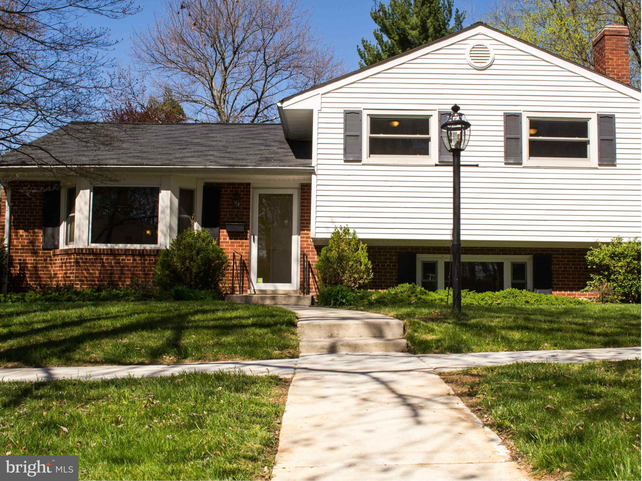 4227 Isbell Street Silver Spring, MD 20906 - Photo 1 of 1 a front view of a house with a yard