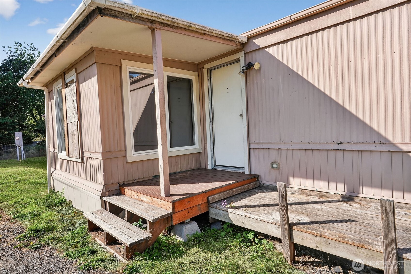 24525 59th Avenue Southwest Vashon, WA 98070 - Photo 13 of 26 a backyard of a house with seating space