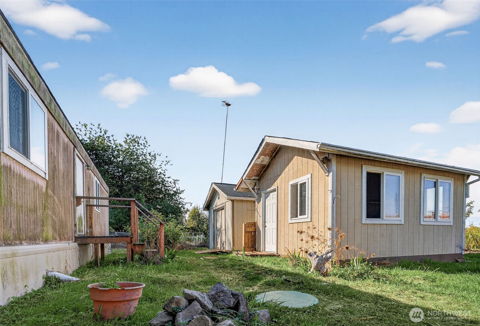 24525 59th Avenue Southwest Vashon, WA 98070 - Photo 22 of 26 a front view of a house with a yard