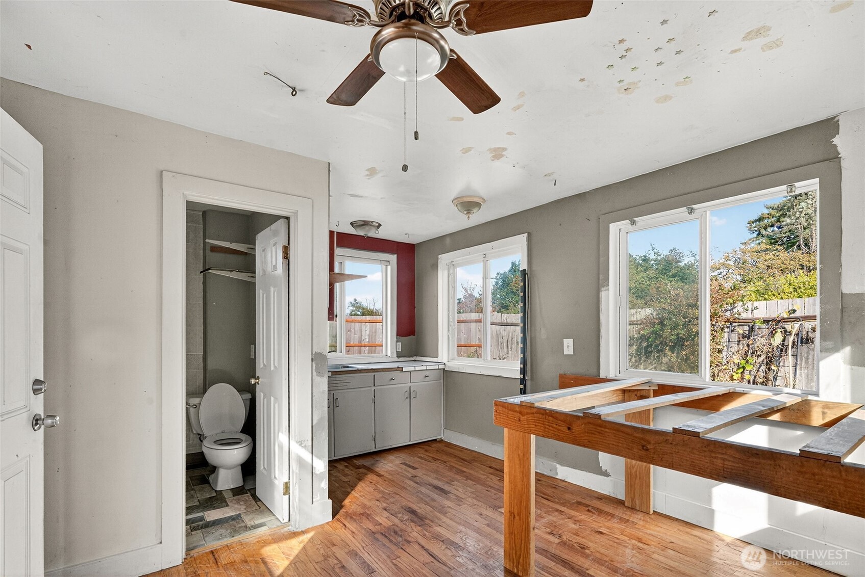 24525 59th Avenue Southwest Vashon, WA 98070 - Photo 23 of 26 a living room with stainless steel appliances granite countertop furniture and a large window