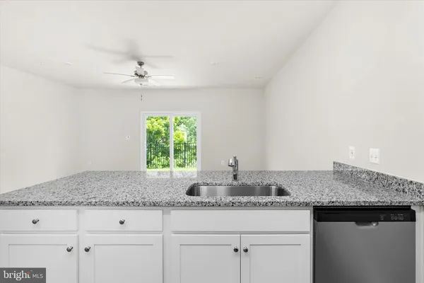 a kitchen with a refrigerator sink and microwave