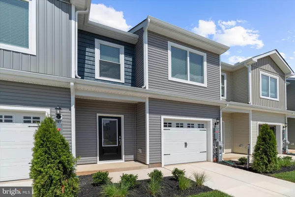 a front view of a house with a garage