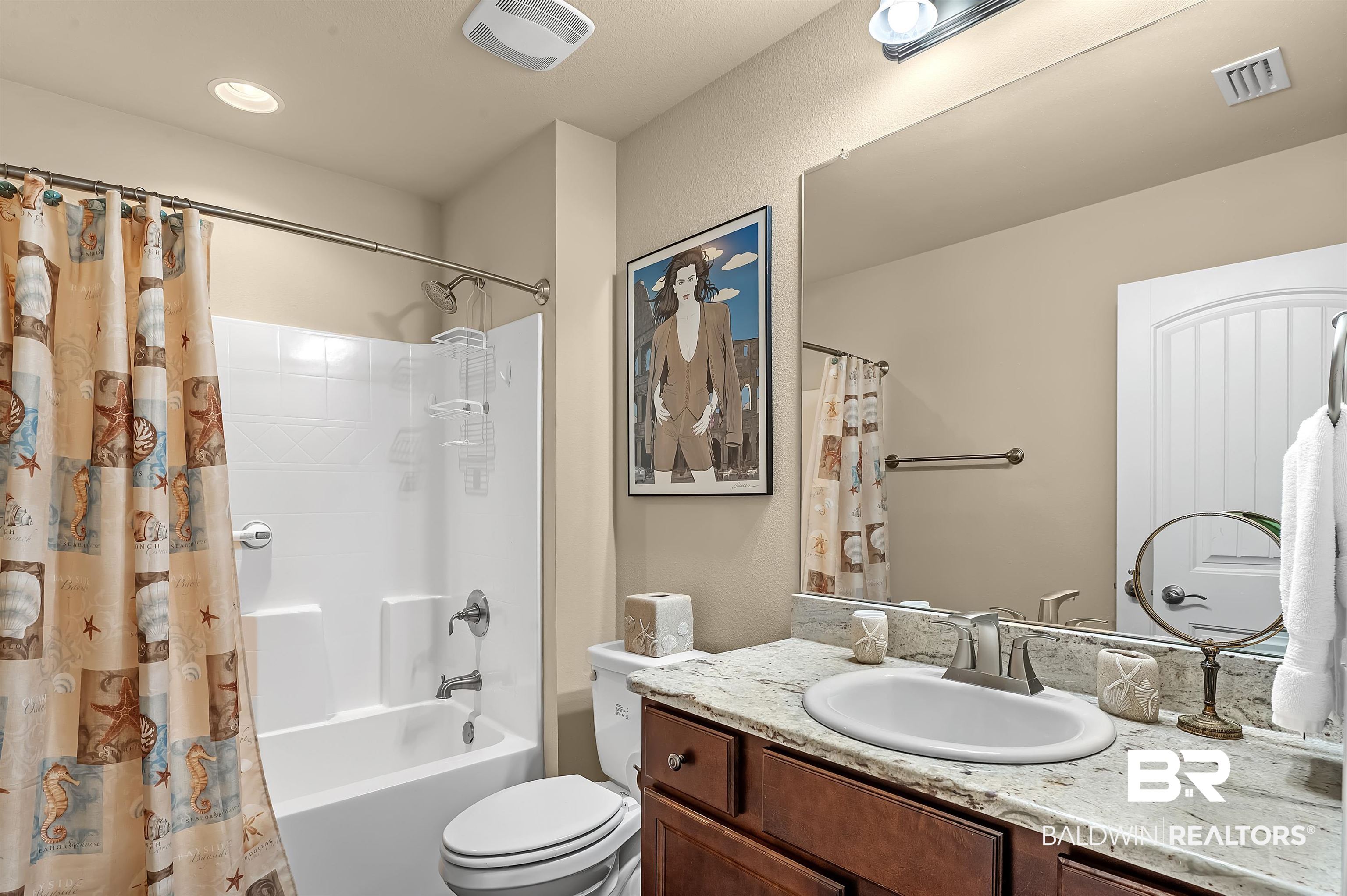 8896 Allay Lane Foley, AL 36535 - Photo 52 of 57 Full bathroom featuring vanity, shower / bath combo with shower curtain, and toilet