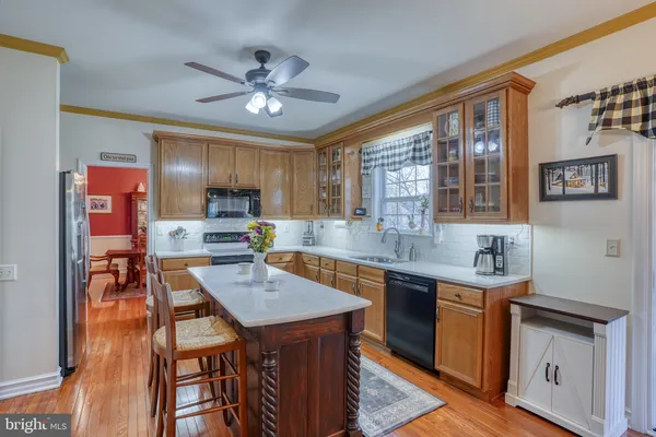 a view of a dining room with furniture wooden floor and chandelier