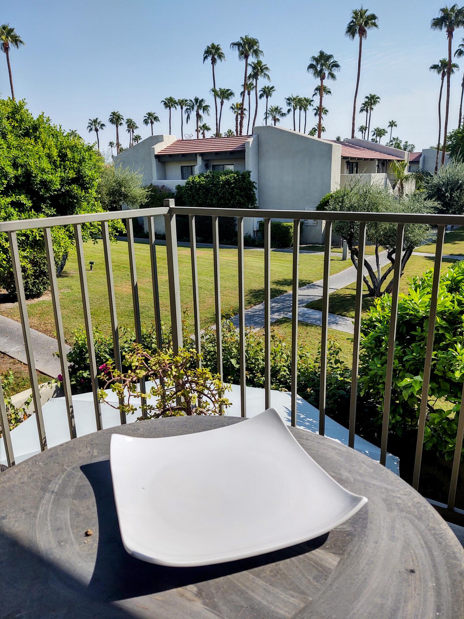 1100 East Amado Road, Unit 13B2 Palm Springs, CA 92262 - Photo 12 of 20 a view of balcony with furniture