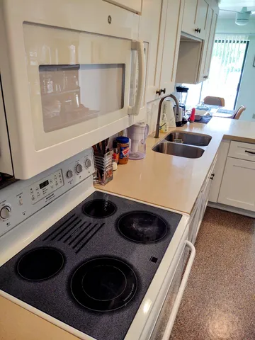 a kitchen with a stove and a sink