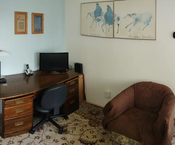 a workspace with furniture and wooden floor