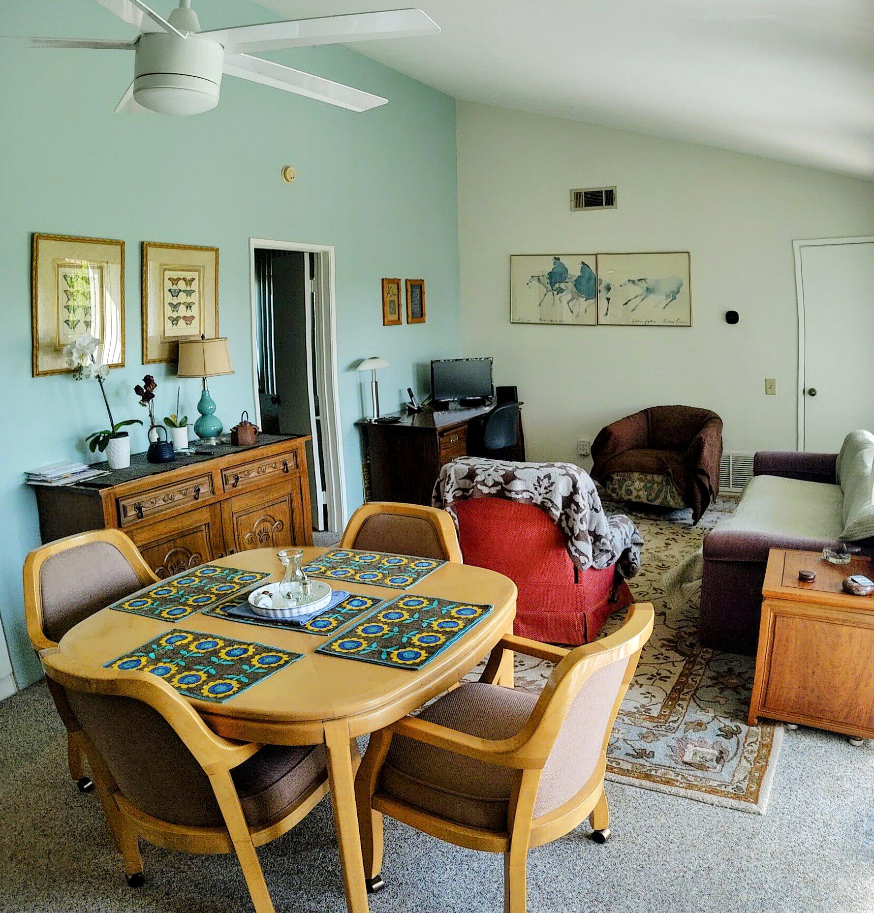 1100 East Amado Road, Unit 13B2 Palm Springs, CA 92262 - Photo 9 of 20 a living room with furniture and wooden floor