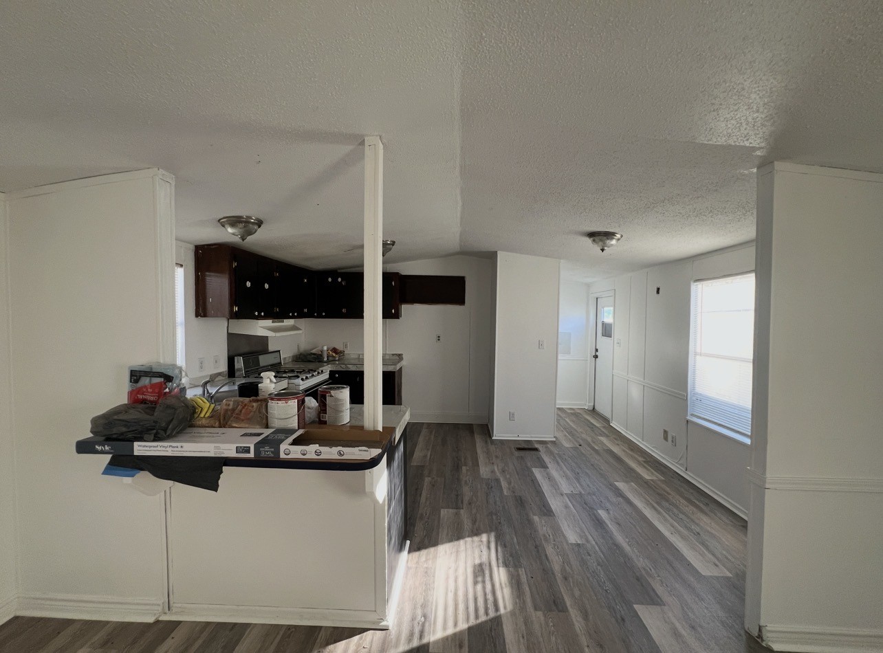 1511-4 Jones Street, Unit 4 Rosenberg, TX 77471 - Photo 7 of 11 a room with two washing machine and wooden floor