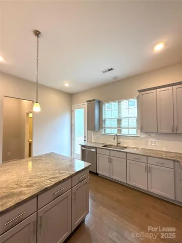a bathroom with a sink mirror and toilet